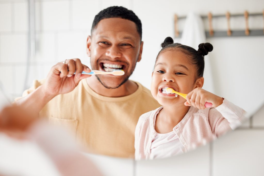 father and daughter practicing proactive dentistry