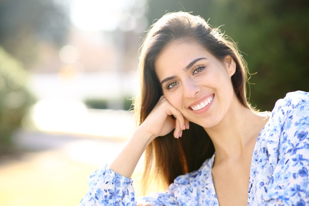 young woman showing off her perfect smile in Southbury